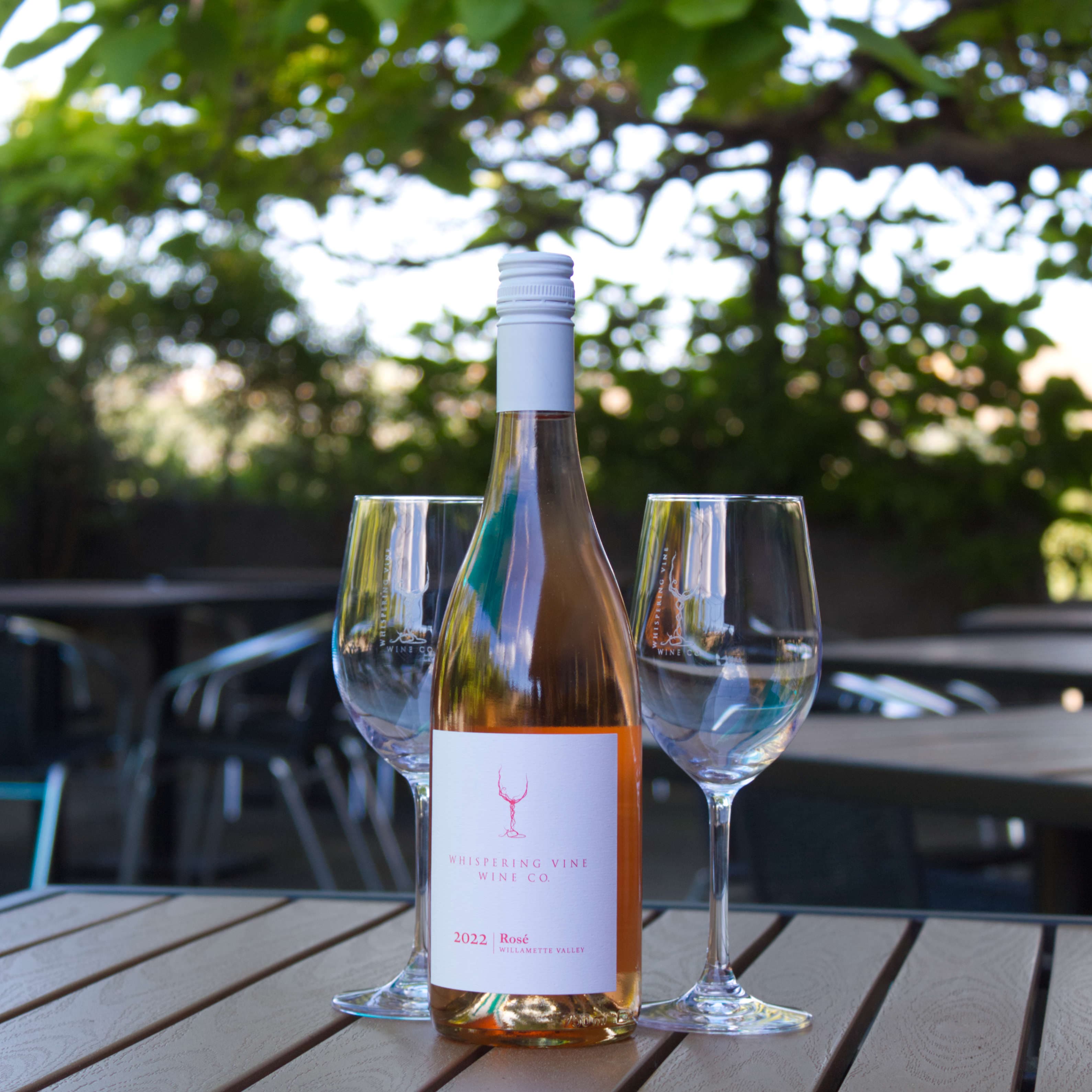 Whispering Vine Rosé bottle and stemware